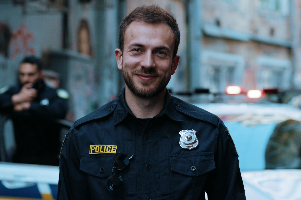 A headshot of a white male police officer.