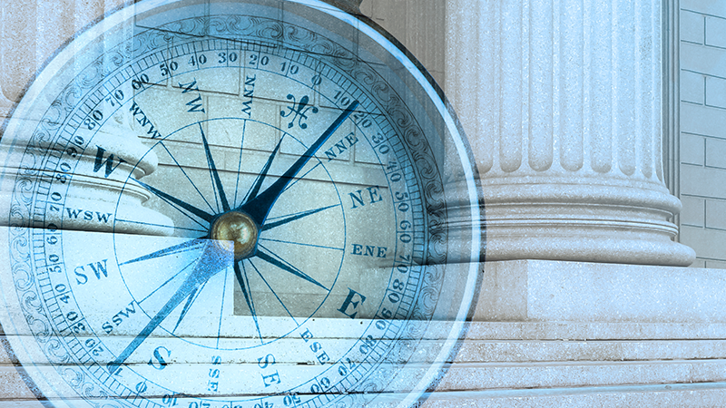 Compass overlayed on government building
